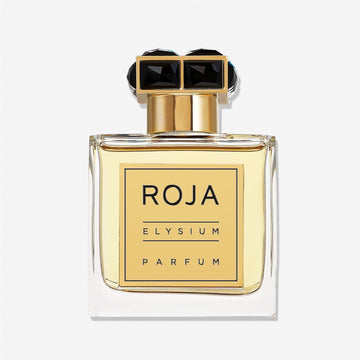 A clear glass bottle of Roja Parfums Elysium Pour Homme parfum for men, featuring pale yellow liquid, a gold label and cap with two black gemstones on top, set against a white background. Experience its fresh woody scent with citrus and herbs.