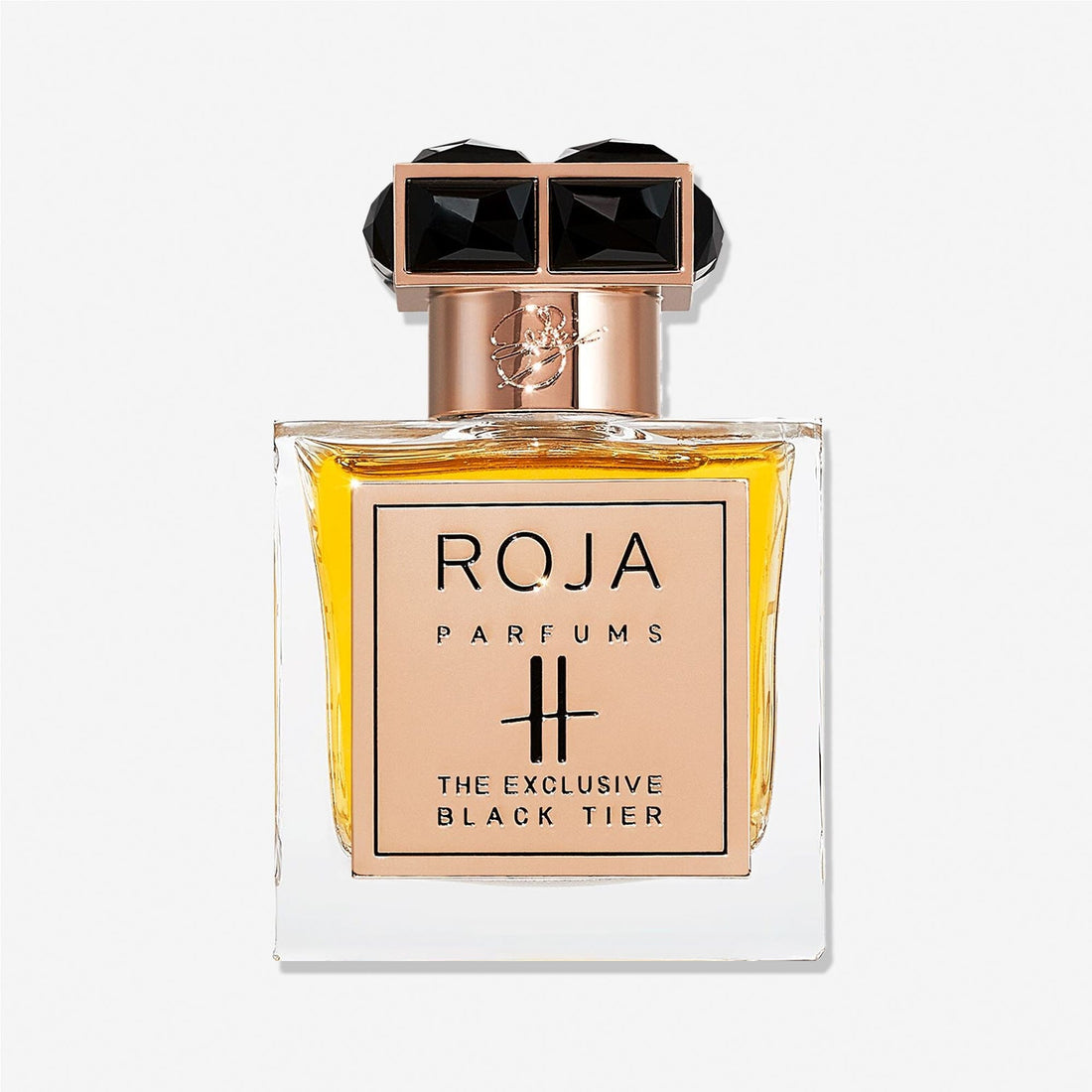 A bottle of Roja Parfums Harrods Black Tier, a luxury perfume in a square glass bottle filled with golden liquid, topped with a gold cap featuring two black gemstone-like accents.