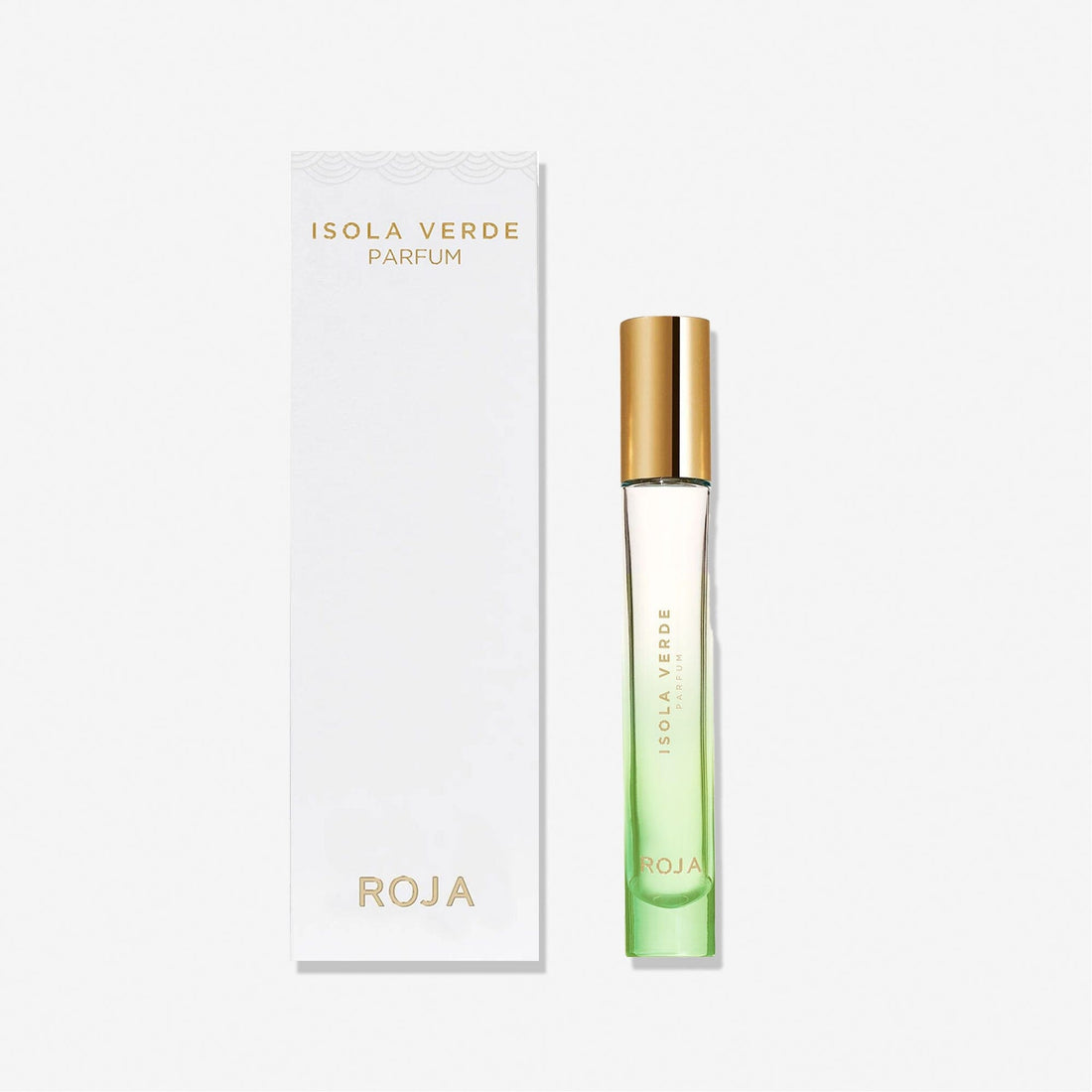 A slim glass bottle of Roja Parfums Isola Verde, featuring a gold cap and green gradient liquid, stands beside a white box with gold text. The fragrance blends exotic blooms and succulent fruits, capturing the spirit of Isola Verde.