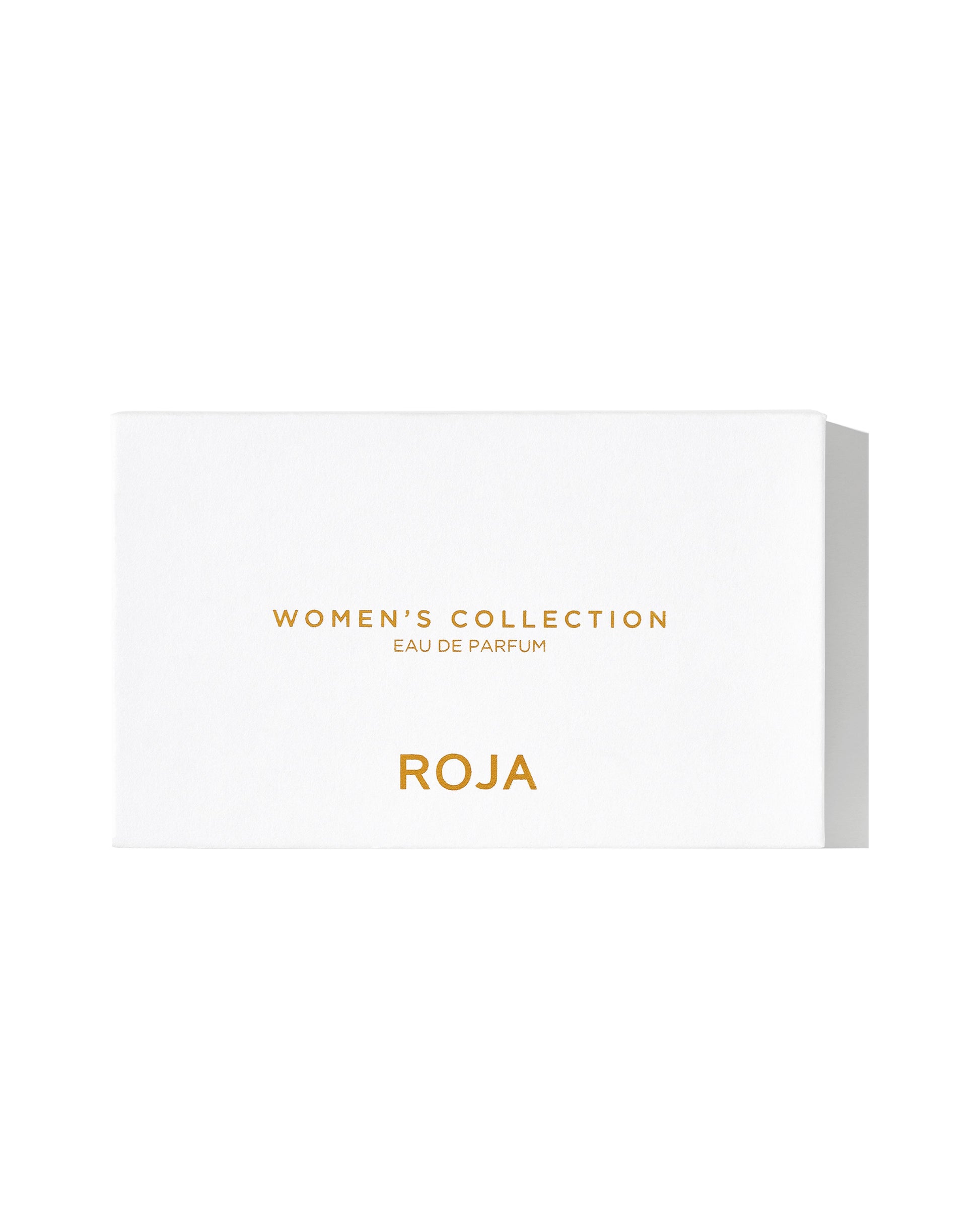 A white rectangular box with gold text that reads The Womens Discovery Collection and Roja Parfums on the front, set against a plain background—a stylish showcase for luxury perfume from Roja Parfums.