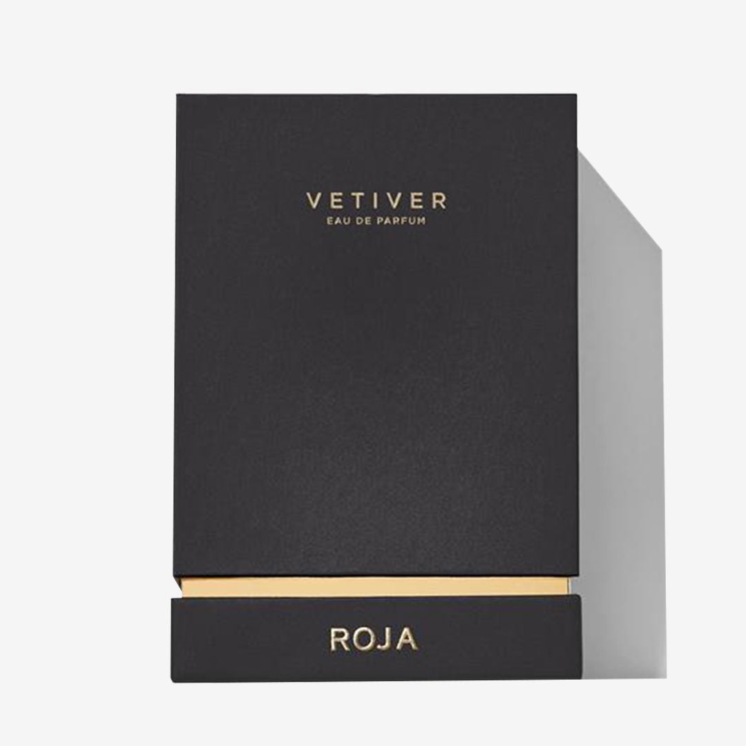 A sleek black box with gold accents labeled Vetiver Pour Homme on the front and Roja Parfums at the base hints at a bold, masculine scent—ideal for those who appreciate a refined, smoky cologne.