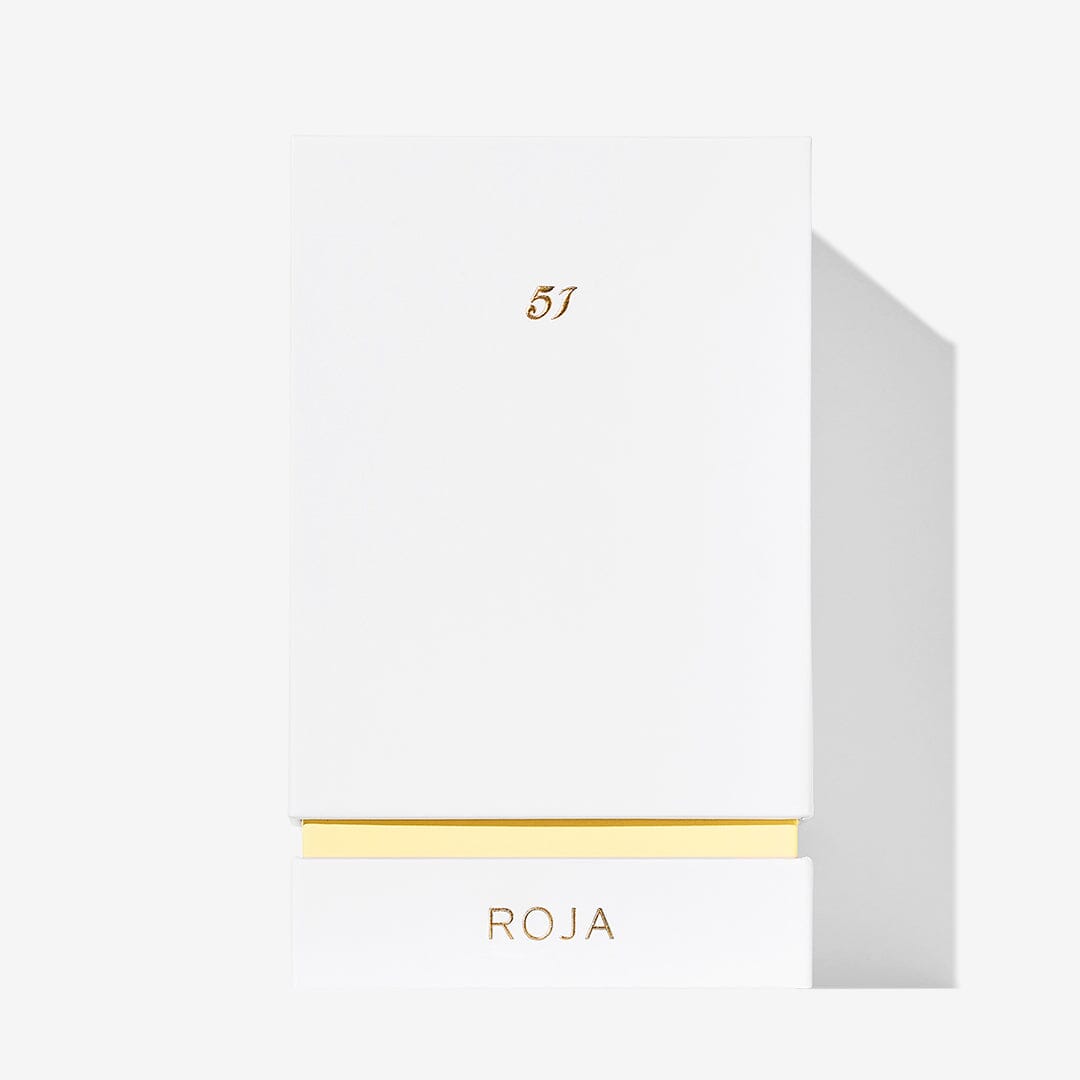 A minimalist white box with gold accents features the number 51 at the top and ROJA at the bottom, reflecting Roja Parfums 51 Pour Femme—a luxury fragrance inspired by their iconic Mayfair boutique in London.