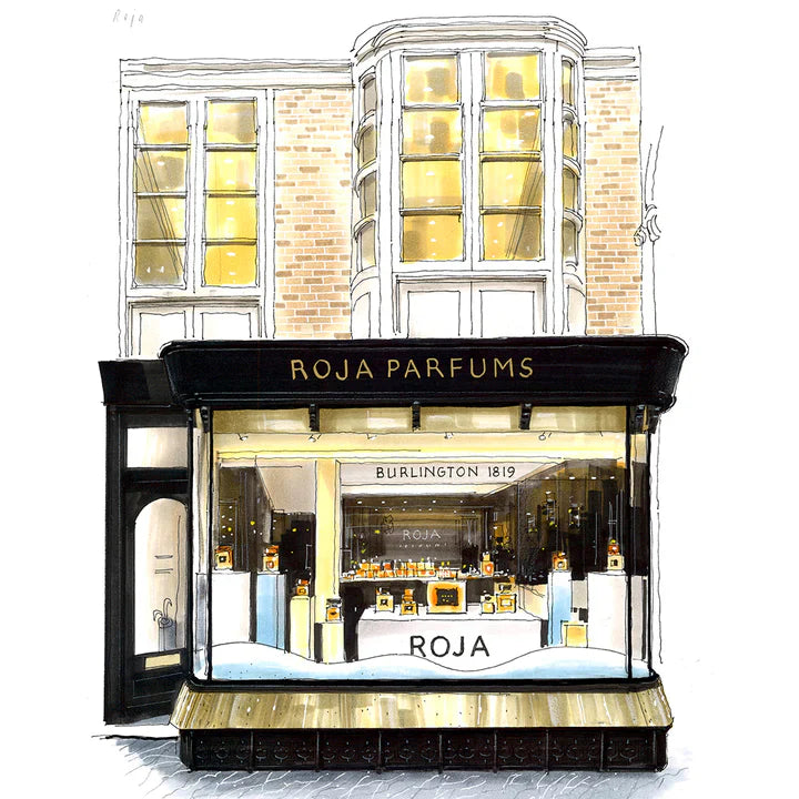 Illustration of a perfume shop with large front windows displaying bottles. The black sign above the entrance reads Roja Parfums. Upper floors have tall windows, and the building has a classic, elegant design.