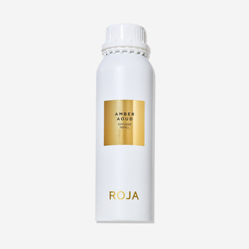 A white bottle with a gold label reading "Amber Aoud Diffuser Refill" and "Roja Parfums" at the base, topped with a white screw cap—ideal for pairing with your Amber Aoud candle or enjoying its rich, spicy aroma on its own.