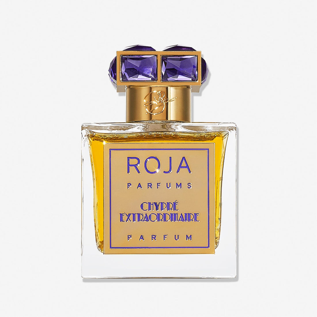 A square glass bottle of Roja Parfums Chypré Extraordinaire features golden yellow liquid, a gold cap with two large purple gemstones, and a gold and purple front label.
