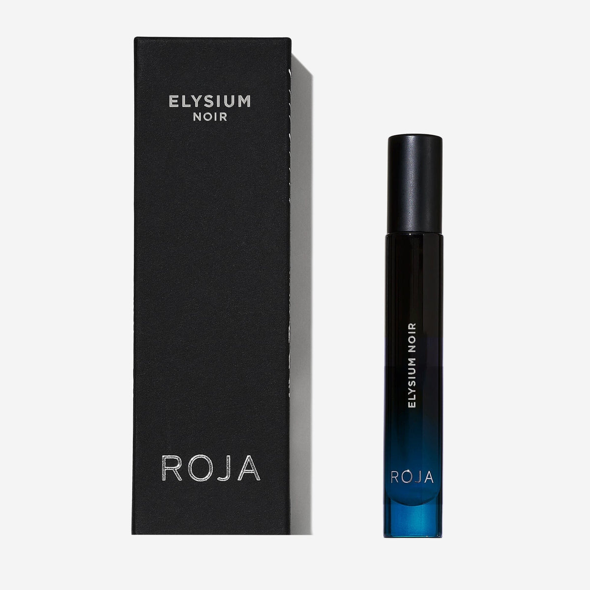 A sleek black box labeled "Elysium Noir" by Roja Parfums stands beside a matching dark blue and black perfume spray bottle, also labeled "Elysium Noir," both set against a white background.
