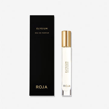 A sleek perfume bottle with a gold cap labeled Elysium Pour Homme by Roja Parfums, a luxury men's fragrance, stands beside a matching black and gold gift box on a white background.