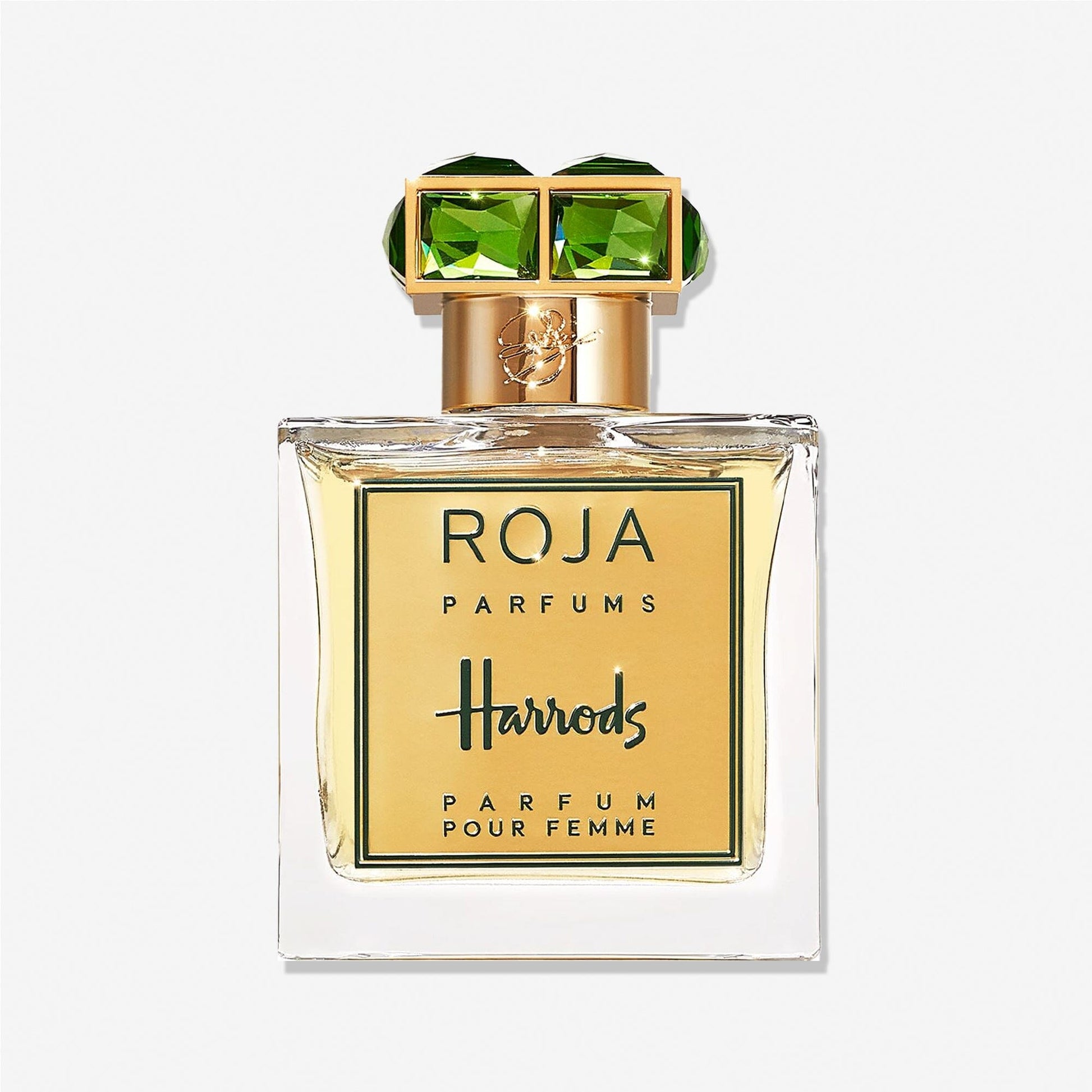 A square glass bottle of Roja Parfums Harrods Pour Femme features a gold label and green gemstone-like cap accents, evoking rose and sandalwood notes, displayed against a plain white background.