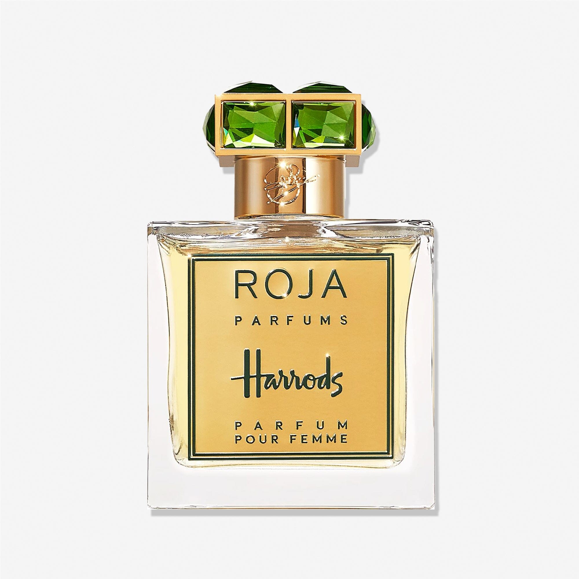 A square glass bottle of Roja Parfums Harrods Pour Femme features a gold label and green gemstone-like cap accents, evoking rose and sandalwood notes, displayed against a plain white background.
