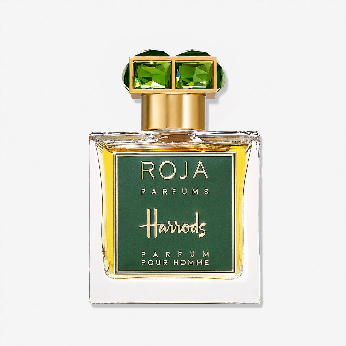 A glass bottle of Roja Parfums Harrods Pour Homme, a Harrods exclusive fragrance, features a green and gold label and a gold cap adorned with two green, gem-like squares.