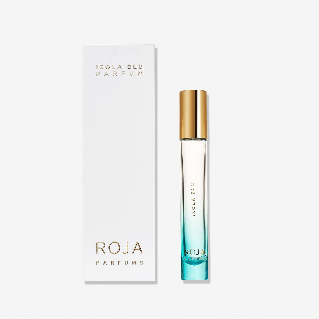 A slender glass bottle of Isola Blu by Roja Parfums, featuring a gold cap and blue-tinted citrus perfume, stands next to a white box with gold and blue lettering—ideal for fine dining occasions.