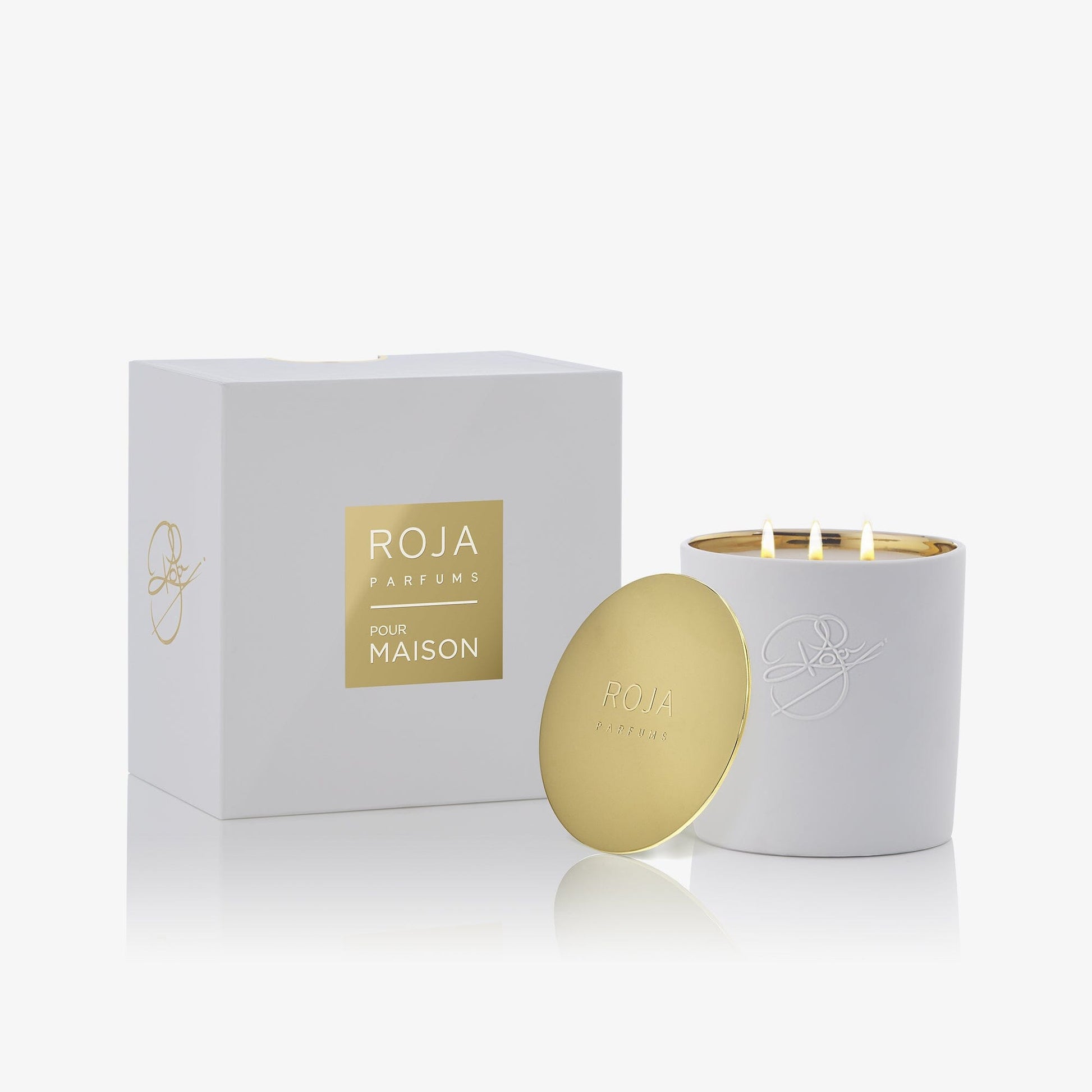 A white luxury Peony Of Luoyang candle by Roja Parfums with three wicks, a gold lid resting on the side, and a matching white and gold box in the background—an elegant floral fragrance to enhance any space.