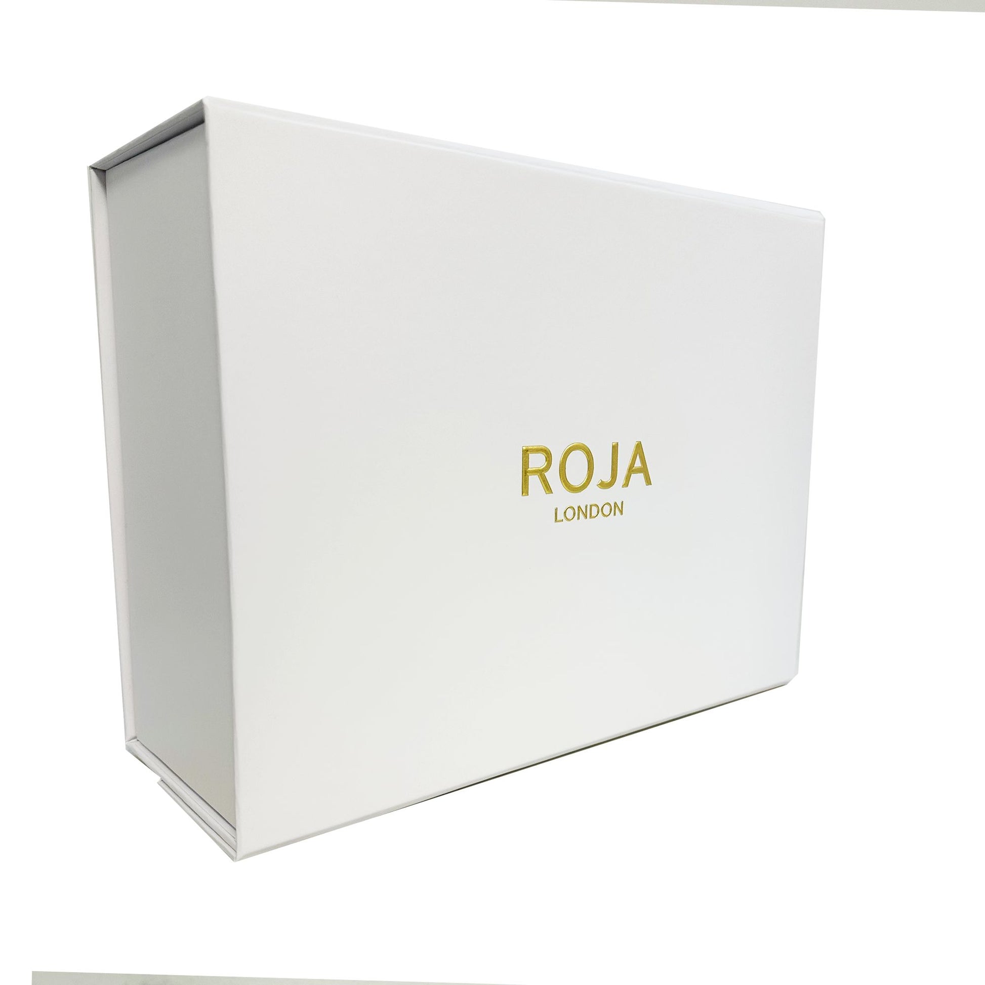 A white rectangular box with gold ROJA PARFUMS branding sits against a plain background—perfect for presenting The Aoud Layering Gift Set, inspired by luxurious Oud and exquisite Agar Wood.