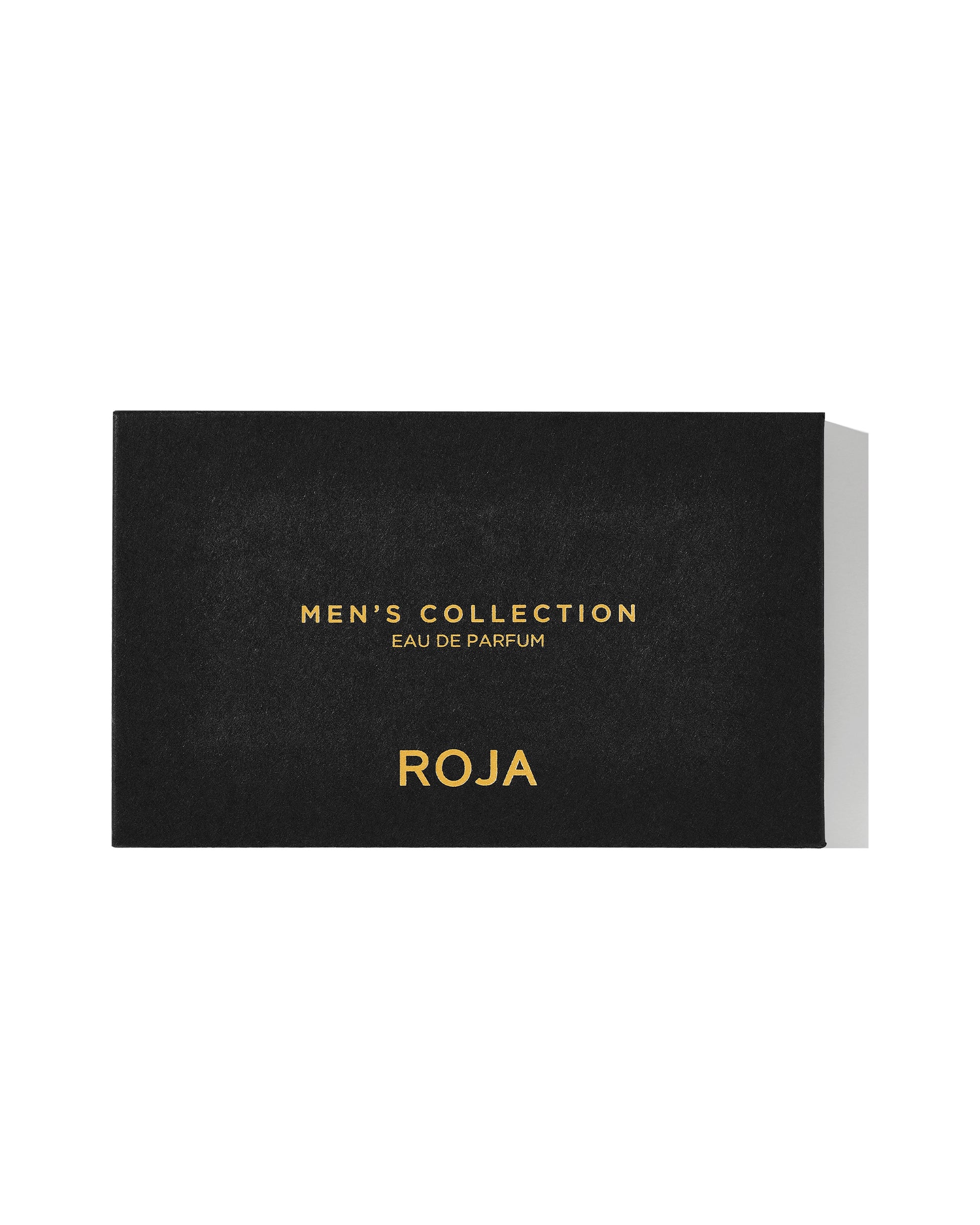 A sleek black rectangular box with gold text—The Mens Discovery Collection by Roja Parfums—stands out against a white backdrop, marking an elegant introduction to masculine scents.