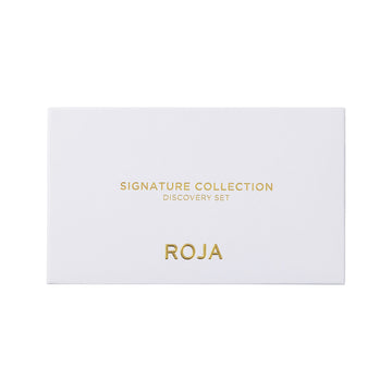 Encased in a white rectangular box adorned with gold text reading “The Signatures Discovery Collection” and “Roja Parfums,” this luxurious perfume sample set from Roja Parfums invites you to experience olfactory artistry at its finest.